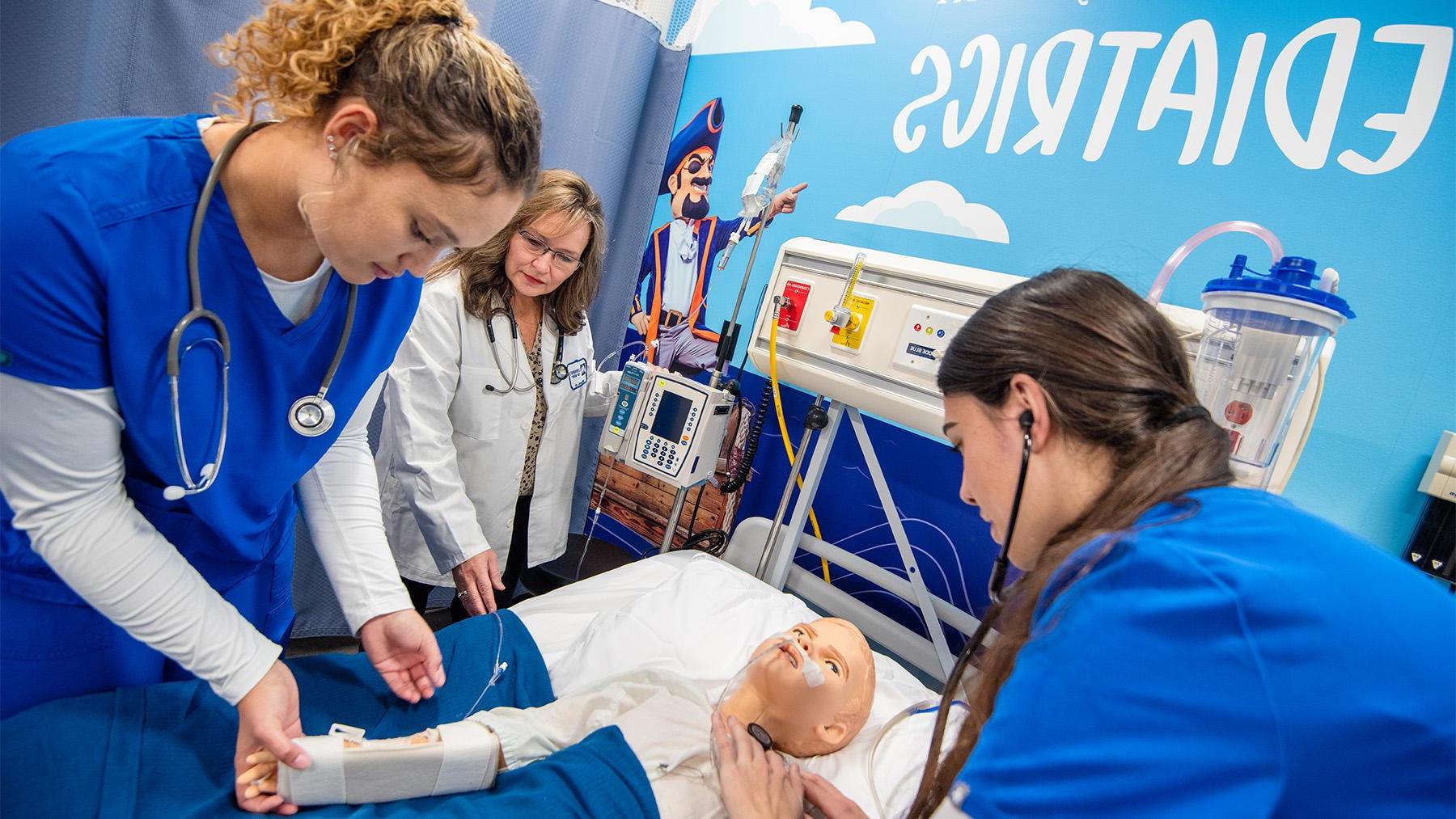 Nursing students working in the simulation labs.